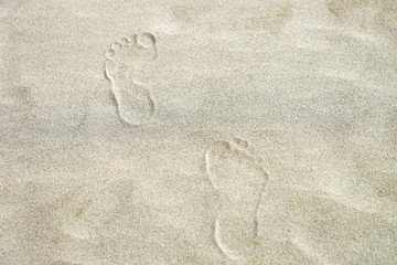 Footprints on sand at coastline of Danang