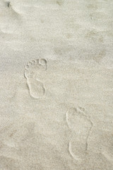 Footprints on sand at coastline in Danang