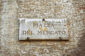 Piazza del Mercato Street sign of wall Siena