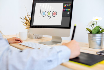 designer designing a logo with computer