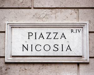 Obraz premium Piazza Nicosia sign on wall in Rome