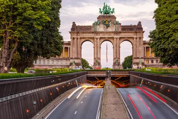 Deurstickers Dramatic view of the Triumphal Arch and Belliard Tunnel in Park Cinquantenaire in Brussels during sunset © beketoff
