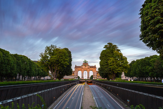 Dramatic view of the Triumphal Arch and Belliard Tunnel in Park Cinquantenaire in Brussels during sunset