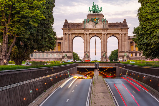 Dramatic view of the Triumphal Arch and Belliard Tunnel in Park Cinquantenaire in Brussels during sunset