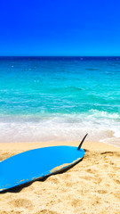 Beach, sea and surf background. Sandy beach, blue sky - Summer relax concept.