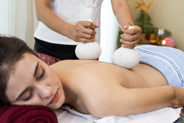 Obraz na płótnie Canvas woman back with bamboo mat in spa salon is having massage, Spa, health and healing concept.