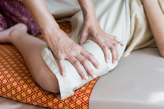 Close-up of woman having leg massage in spa salon. Woman with thai massage. Woman with relax emotion.