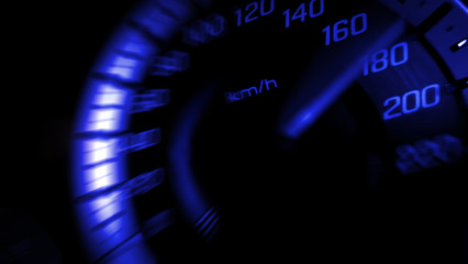 Close up shot of a speed meter in a car with blue light speed at 180 Km/H in concept racing car