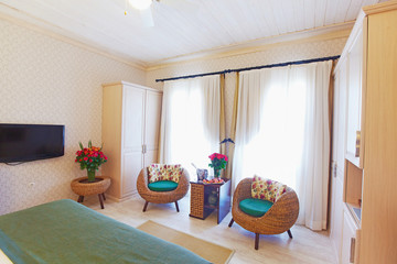 Two rattan chairs in hotel room
