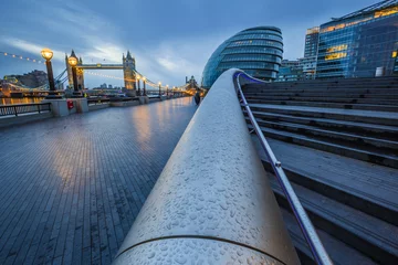 Poster London, England - Tower Bridge and office buildings on a rainy day at blue hour © zgphotography