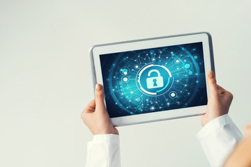 Close of female doctor hands working with tablet pc computer