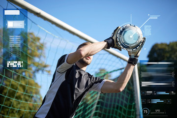 goalkeeper with ball at football goal on field