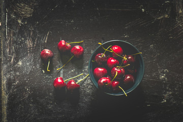cherries berries in black bowl , vintage style