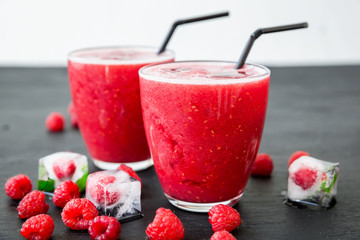 Raspberry ice cold refreshing cocktail with tasty berries.