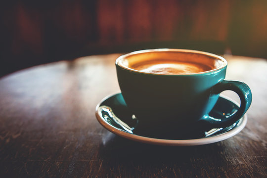 Soft focus of Hot Coffee Latte Cup on Table in Cafe or Restaurant