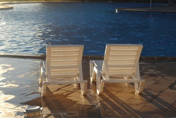 Well, that ended the day! over the holiday!/ two sun beds by the pool at sunset - 165924196