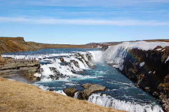 Gullfoss waterfall, rainbow, blue sky, Iceland