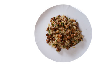 rice with mushrooms on plate. top view. isolated on white