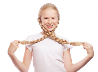 Portrait of a beautiful European blonde girl with braids.