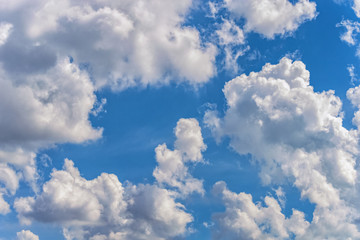 Naklejka na ściany i meble background of a blue sky with a white clouds
