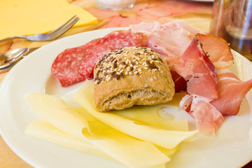 Salami sausages and bread with seeds at breakfast