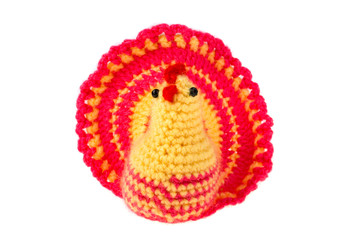 Knitted chicken on white background