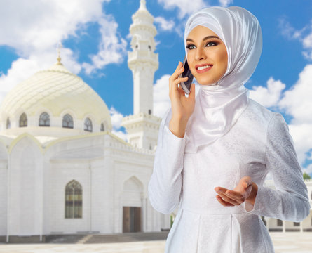 Muslim woman at mosque background
