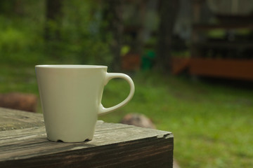 cup of coffee or tea in outdoor, copy space