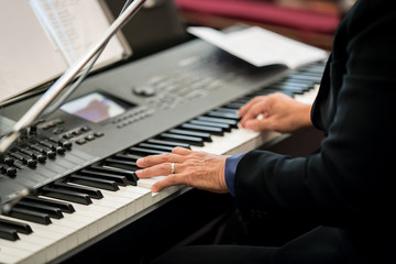 Fototapeta na wymiar Pianist playing electric piano