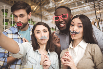 Students in the cafe study together education concept