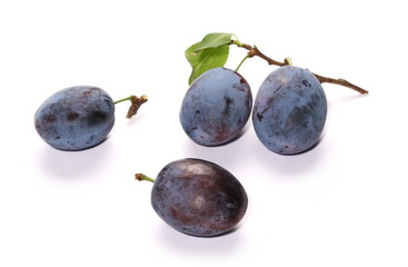 Fresh plums isolated on white background