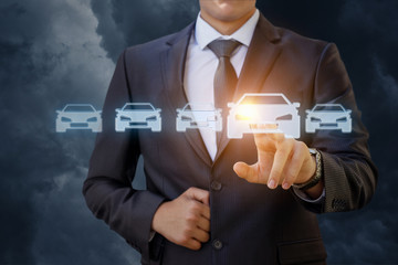 The businessman selects a car .