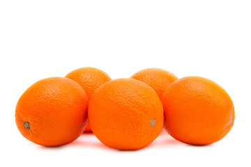 Whole oranges on a white background