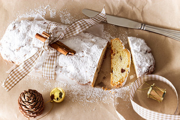 Christmas Stollen. Traditional German festive cake with nuts and dried fruits. Top view. Toned photo. Selective focus