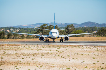 Fototapeta na wymiar Beautiful airplane. Before start to runaway for departure from airport