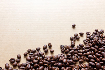coffee bean on paper with soft-focus and over light in the background. top view