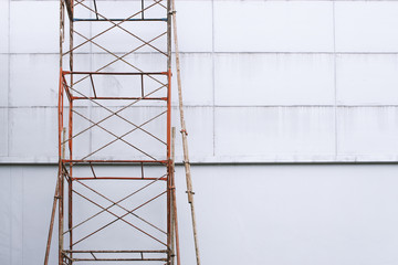 scaffolding on building with soft-focus and over light in the background