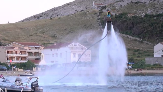 Water jet hoverboard display show in small harbor