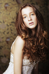 young woman with long curly hair