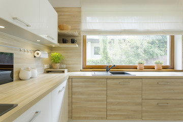 Modern kitchen with wooden cabinets - obrazy, fototapety, plakaty