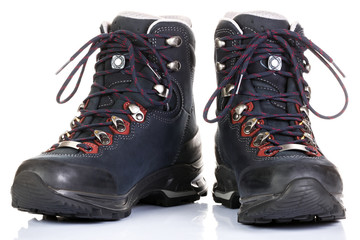 Tourist boots for mountain hikes with reinforced soles and membrane material.