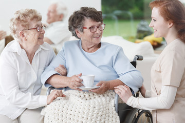 Nurse and senior women have fun