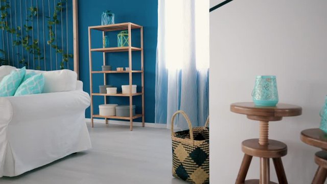 Bright white and blue living room with turquoise accents
