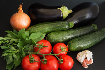 Mixed whole uncooked vegetables and herbs