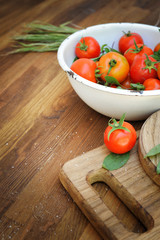 Tomatoes background on a vintage wooden background