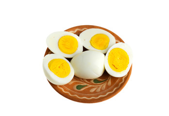 Boiled eggs on a plate on a white background