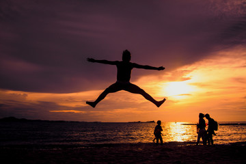 Fototapeta na wymiar Man jumps on the beach