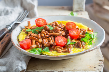 Delicious omelette made of fresh chanterelles mushrooms