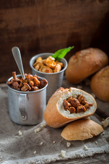 Tasty bun with mushrooms made of fresh chanterelles