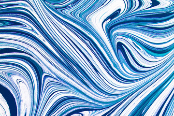 Blue and white paint mixing. Artistic shapes and lines background.